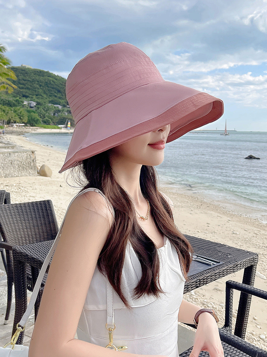 帽子の女性のデザイン感をつなぎ合わせた2色の走線大庇漁師帽韓国は顔が小さくカジュアルな太陽帽網が赤潮している