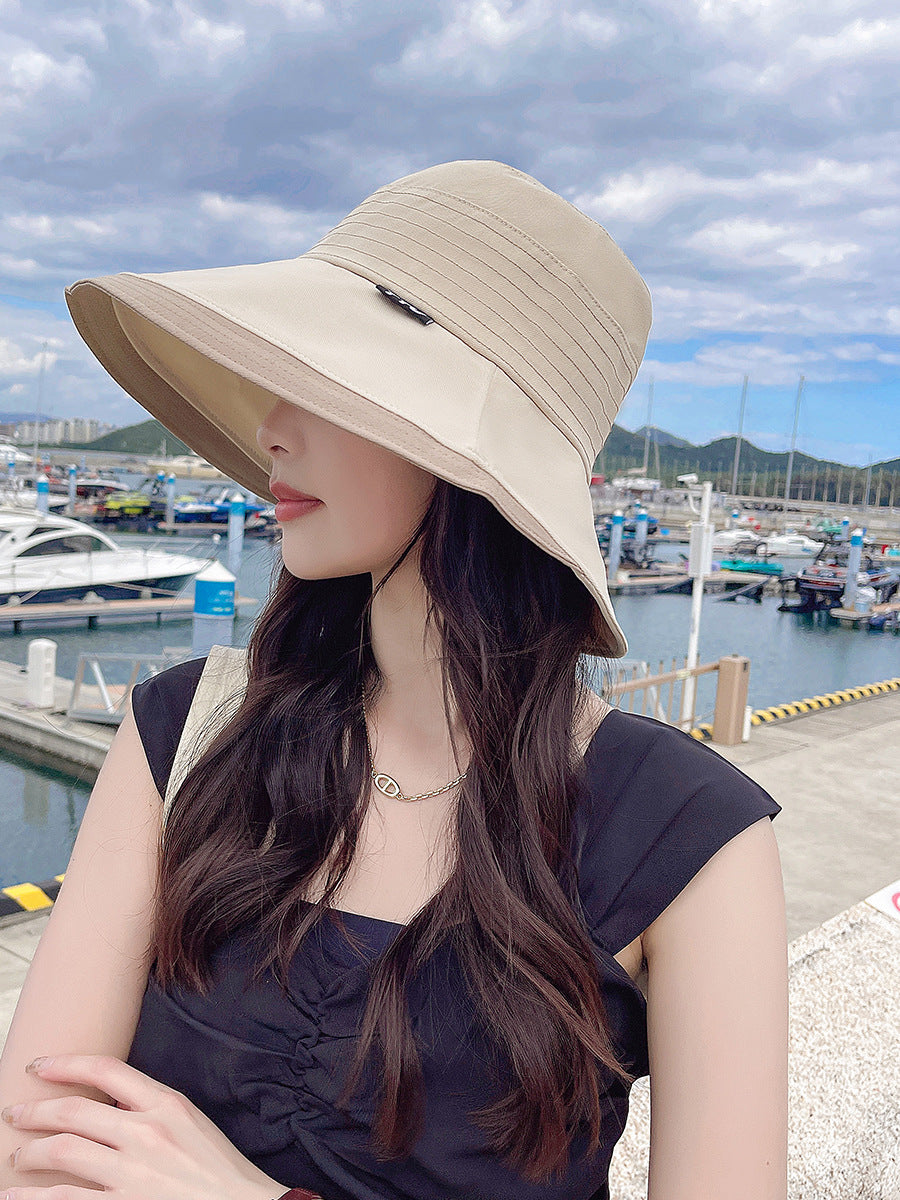 帽子の女性のデザイン感をつなぎ合わせた2色の走線大庇漁師帽韓国は顔が小さくカジュアルな太陽帽網が赤潮している